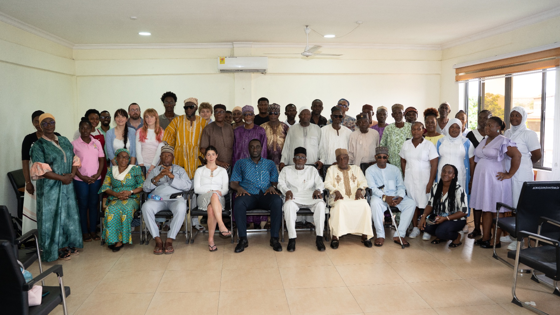 Group photo with community elders and partners