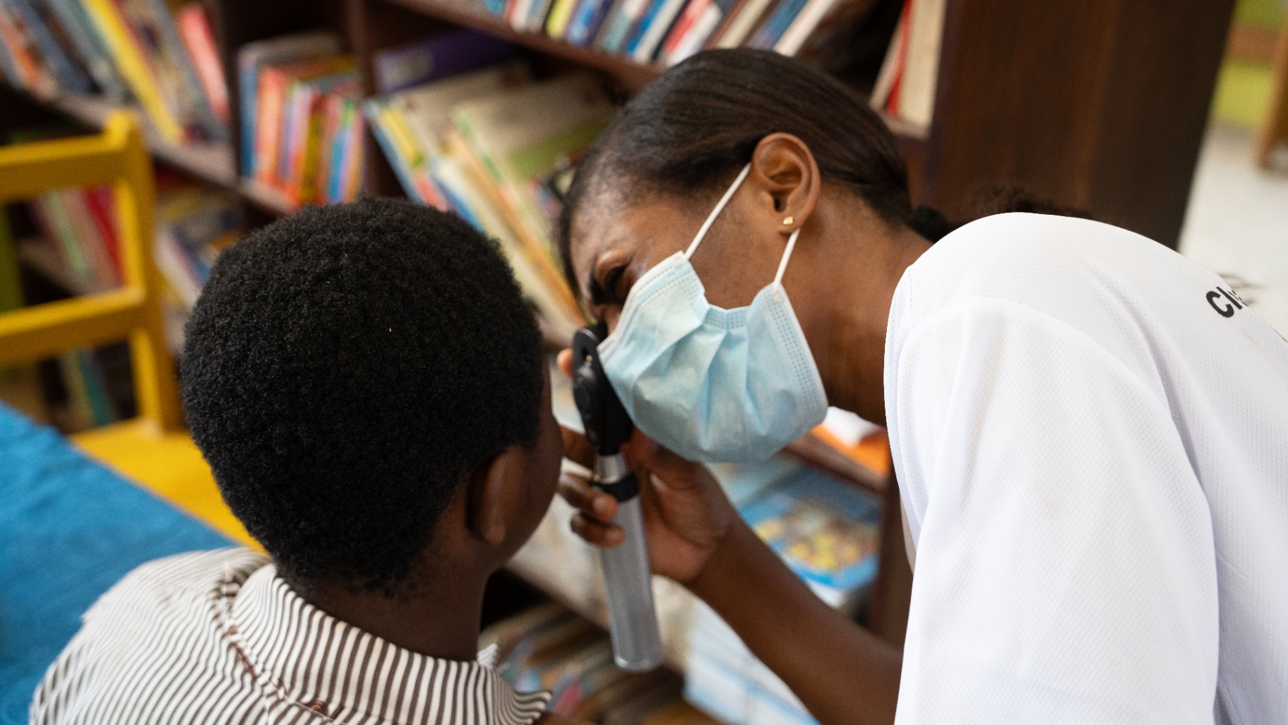 Detailed eye exam during school outreach